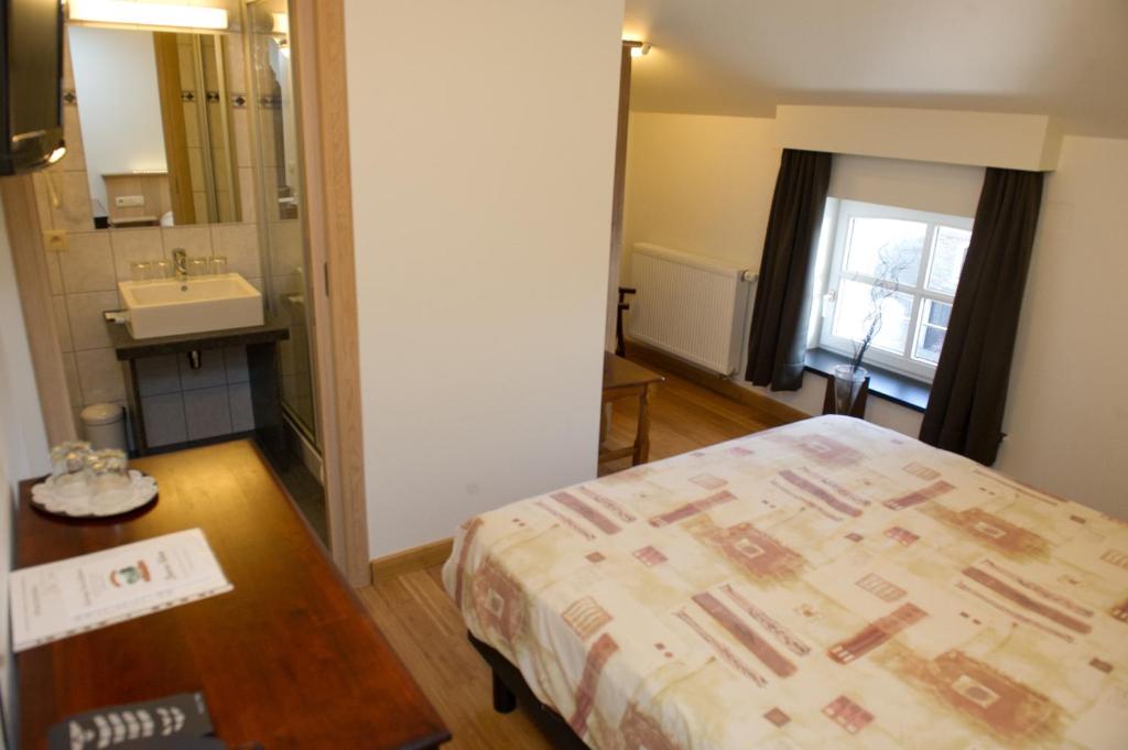 Postel nebo postele na pokoji v ubytování Auberge Saint-Martin
