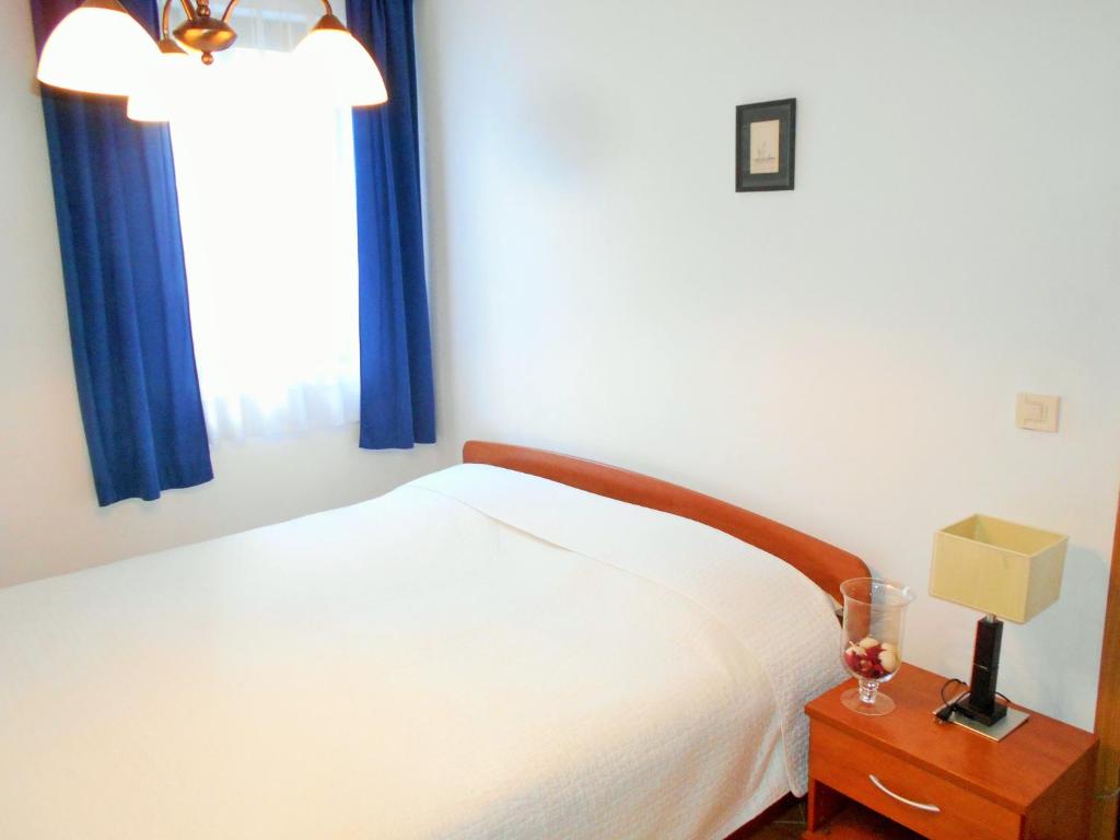 Łóżko lub łóżka w pokoju w obiekcie Apartments Doda