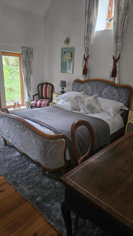Postel nebo postele na pokoji v ubytování The Lions Den - La Loge Guest House