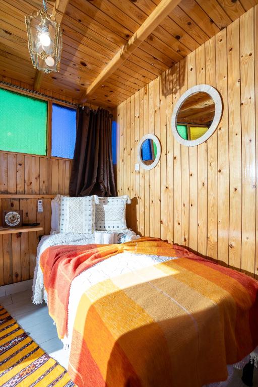 A bed or beds in a room at Dar AL GHAZAL