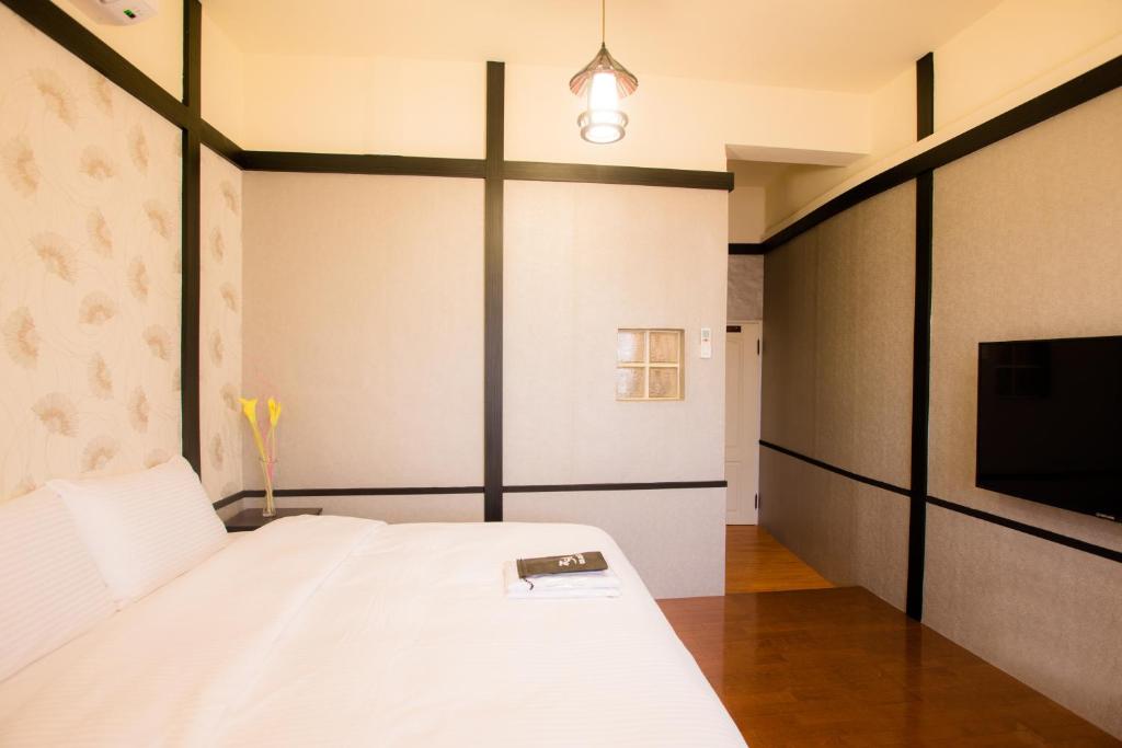 Postel nebo postele na pokoji v ubytování Hananoi Bed and Breakfast