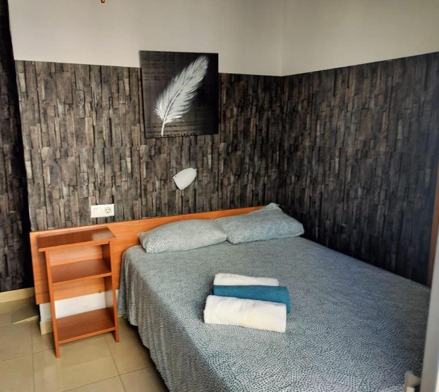 Postel nebo postele na pokoji v ubytování Sant Jordi Cami de Ronda