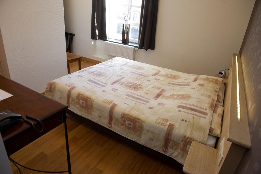 Postel nebo postele na pokoji v ubytování Auberge Saint-Martin