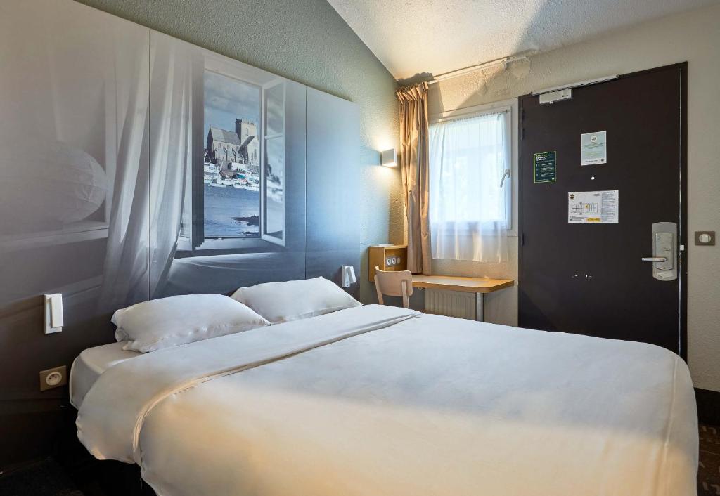 Postel nebo postele na pokoji v ubytování B&B HOTEL Cherbourg