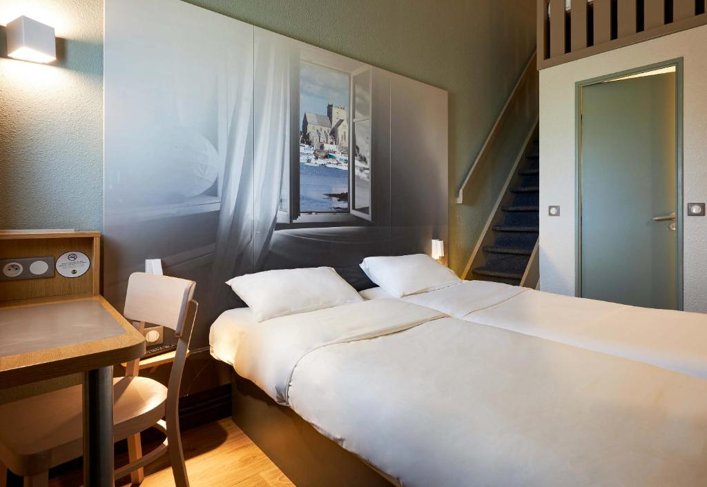 Postel nebo postele na pokoji v ubytování B&B HOTEL Cherbourg