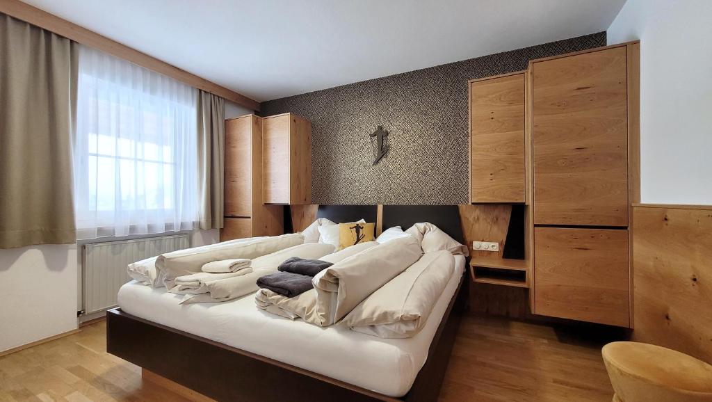 Postel nebo postele na pokoji v ubytování Aparthotel Bernhof