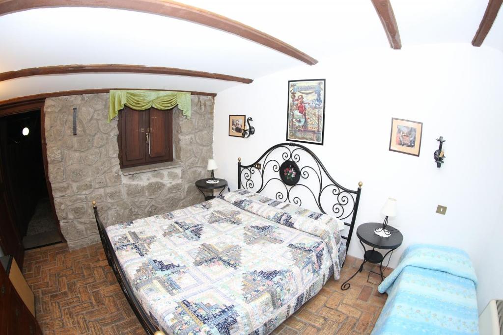 Posteľ alebo postele v izbe v ubytovaní Agriturismo Monte Due Torri
