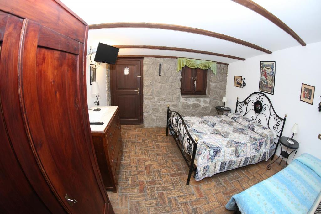 Posteľ alebo postele v izbe v ubytovaní Agriturismo Monte Due Torri