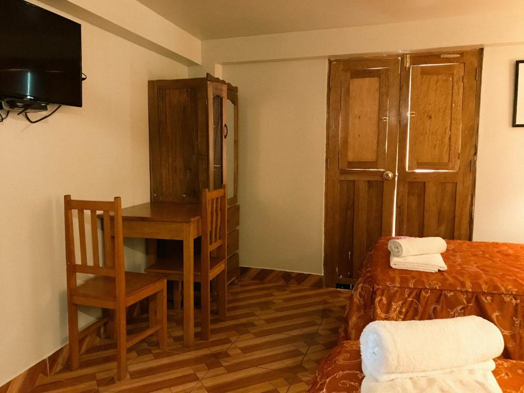 Postel nebo postele na pokoji v ubytování Nafis Casona Apu Linli Pisac