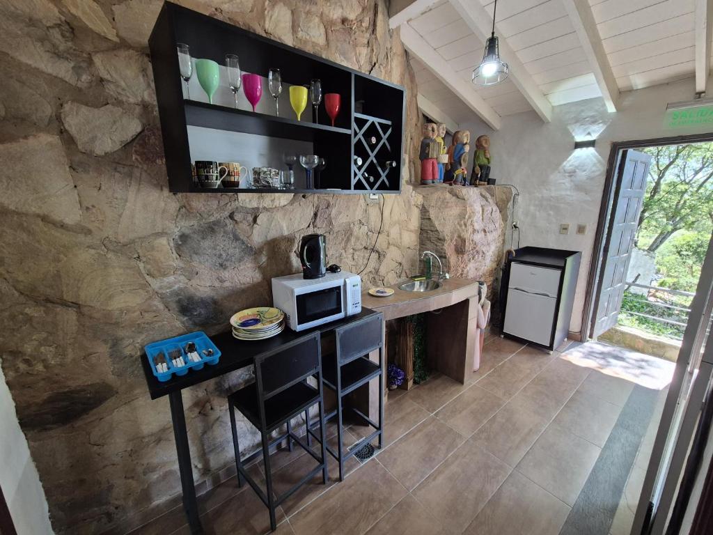 Kuchyň nebo kuchyňský kout v ubytování La Casa del Cerro by Nora Ruoti