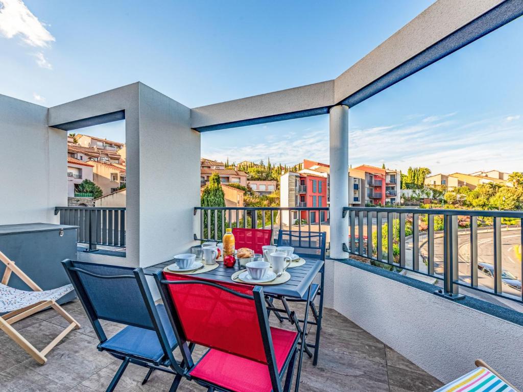 a table and chairs on a balcony with a view at Apartment Collioure le haut-1 by Interhome in Collioure