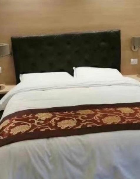 Postel nebo postele na pokoji v ubytování Hotel Alba