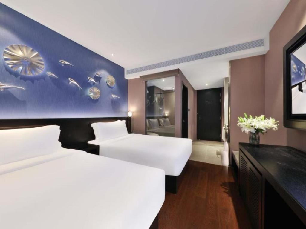 Postel nebo postele na pokoji v ubytování Crystal Orange Hotel - Shanghai The Bund Jinling East Road