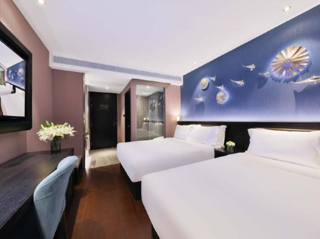 Postel nebo postele na pokoji v ubytování Crystal Orange Hotel - Shanghai The Bund Jinling East Road