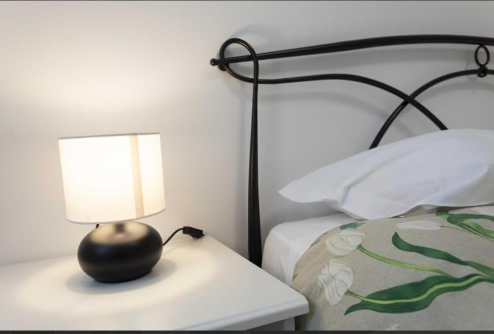 Postel nebo postele na pokoji v ubytování Max Rooms Bergamo