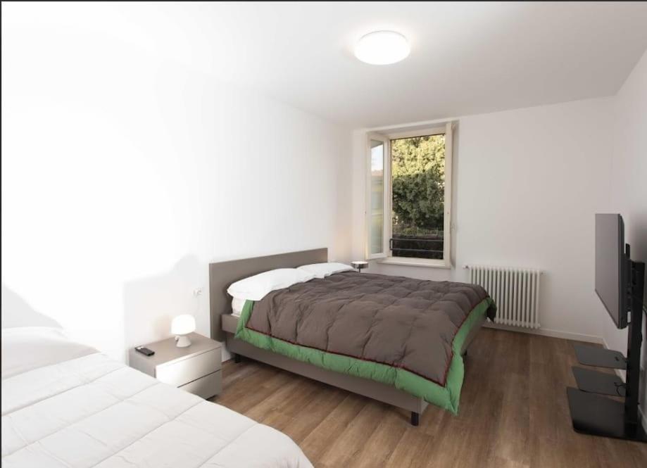 Postel nebo postele na pokoji v ubytování Max Rooms Bergamo