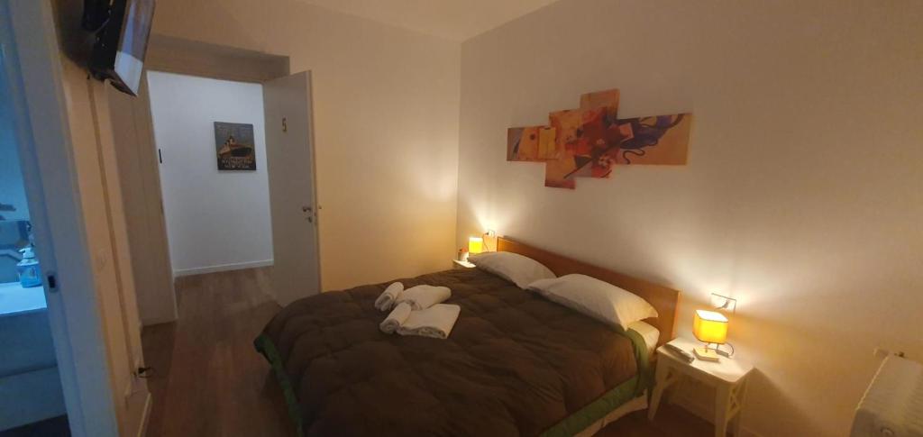 Postel nebo postele na pokoji v ubytování Max Rooms Bergamo