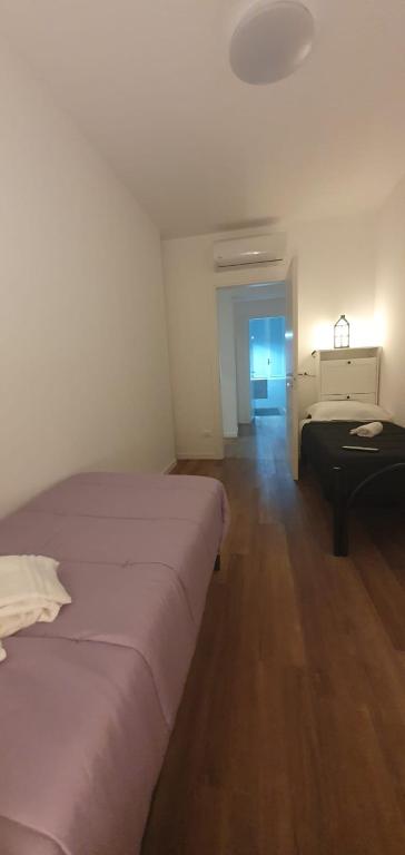 Postel nebo postele na pokoji v ubytování Max Rooms Bergamo