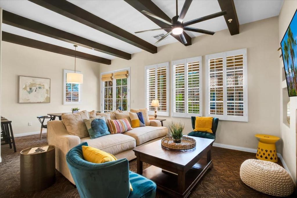 a living room with a couch and a table at Picturesque 1BR in Legacy Villas near Main Pool #A in La Quinta