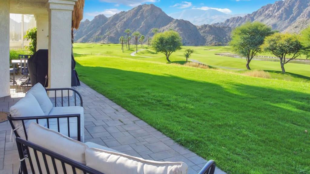 a patio with a view of a golf course at Spacious Villa with Spectacular Golf Course Views in La Quinta