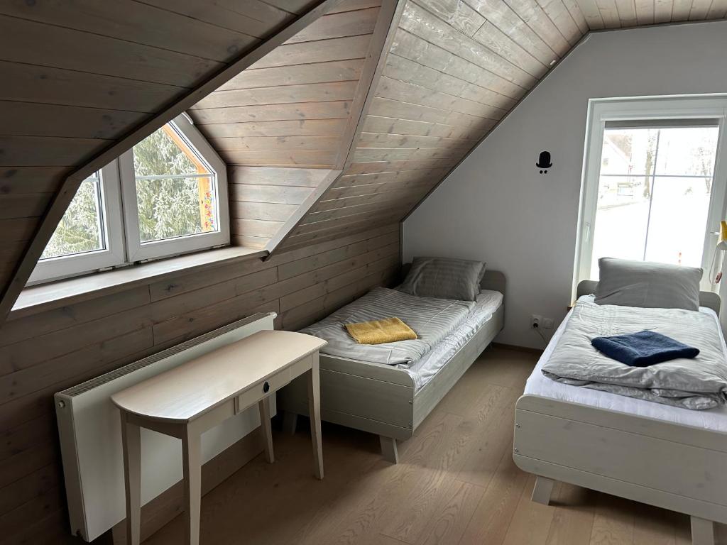 Postel nebo postele na pokoji v ubytování Apartmán v srdci Krkonoš