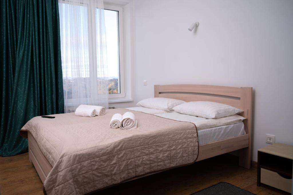 Postel nebo postele na pokoji v ubytování Kamyanka