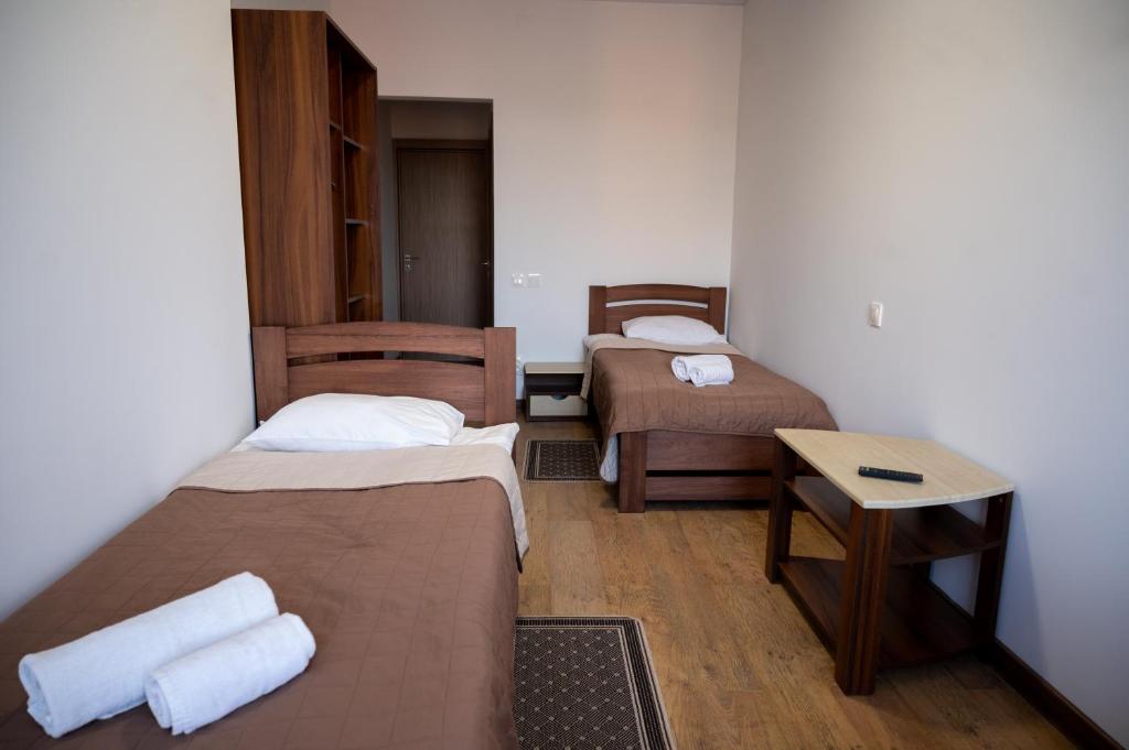 Postel nebo postele na pokoji v ubytování Kamyanka