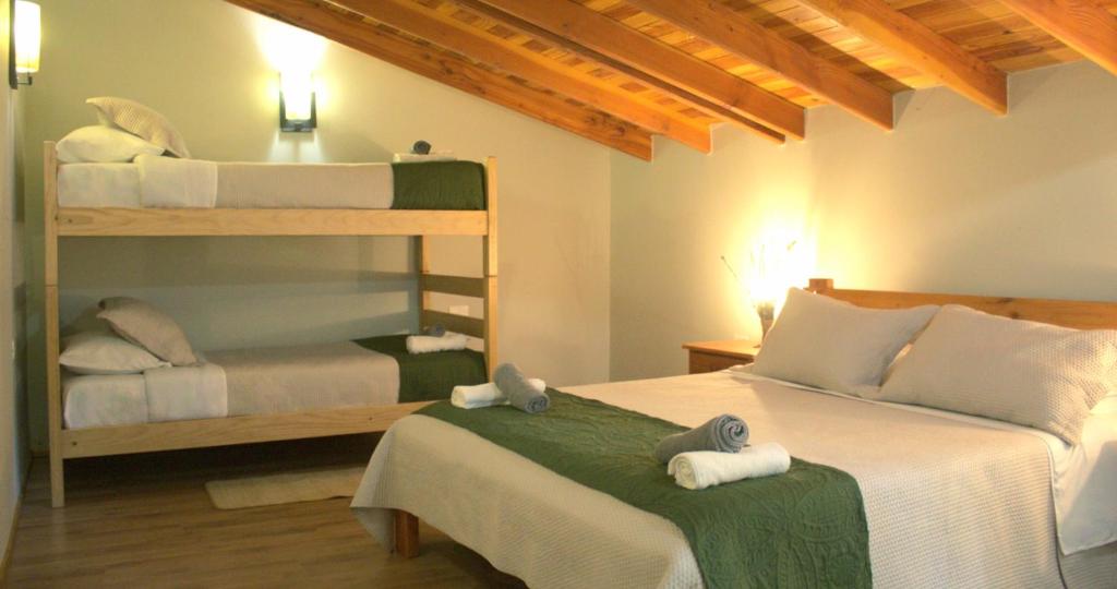 Postel nebo postele na pokoji v ubytování Nido Del Bosque