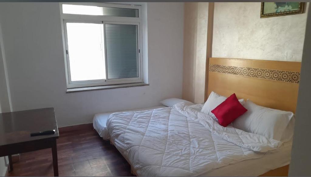Ένα ή περισσότερα κρεβάτια σε δωμάτιο στο Hotel Astoria Tanger