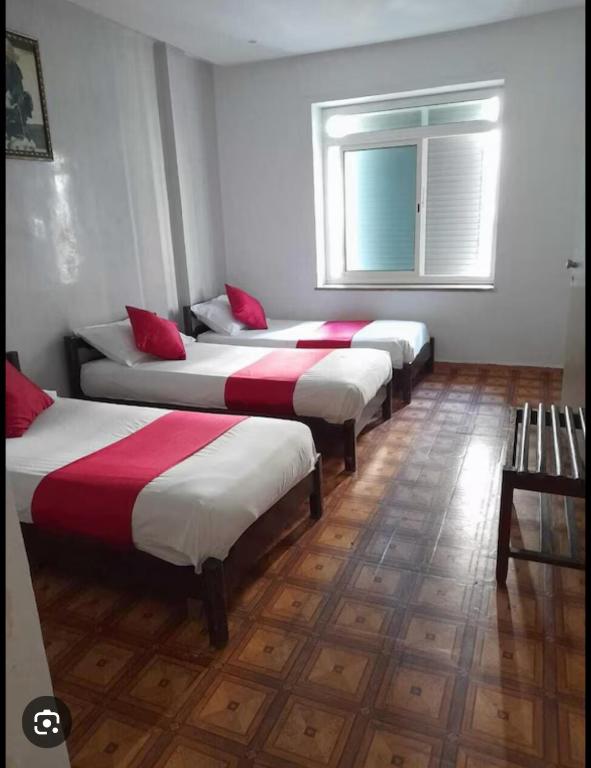 Ένα ή περισσότερα κρεβάτια σε δωμάτιο στο Hotel Astoria Tanger