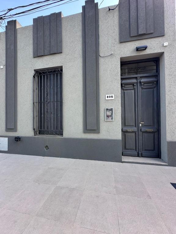 a building with a door on the side of it at Don Tino in San Pedro