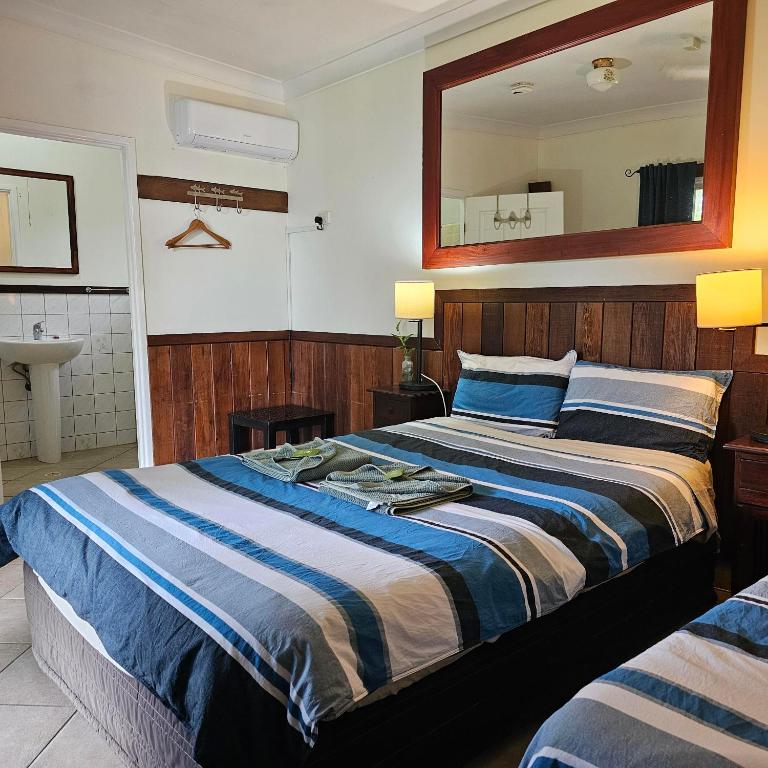 Postel nebo postele na pokoji v ubytování Daintree Riverview Lodges