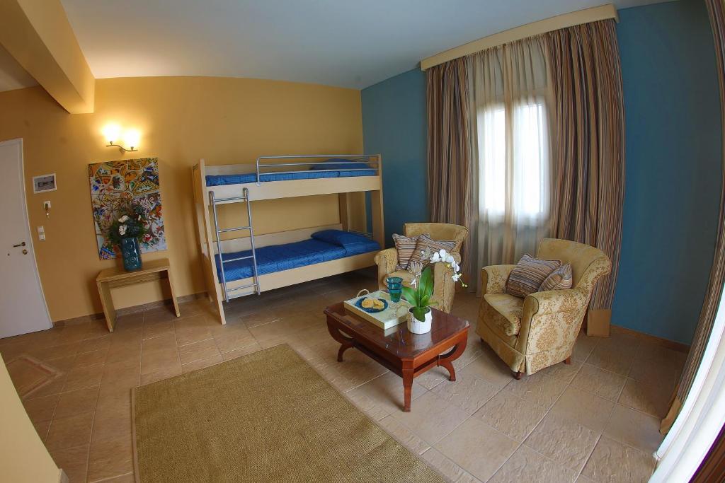 Кровать или кровати в номере Dolphin Bay Seaside Resort & Suites