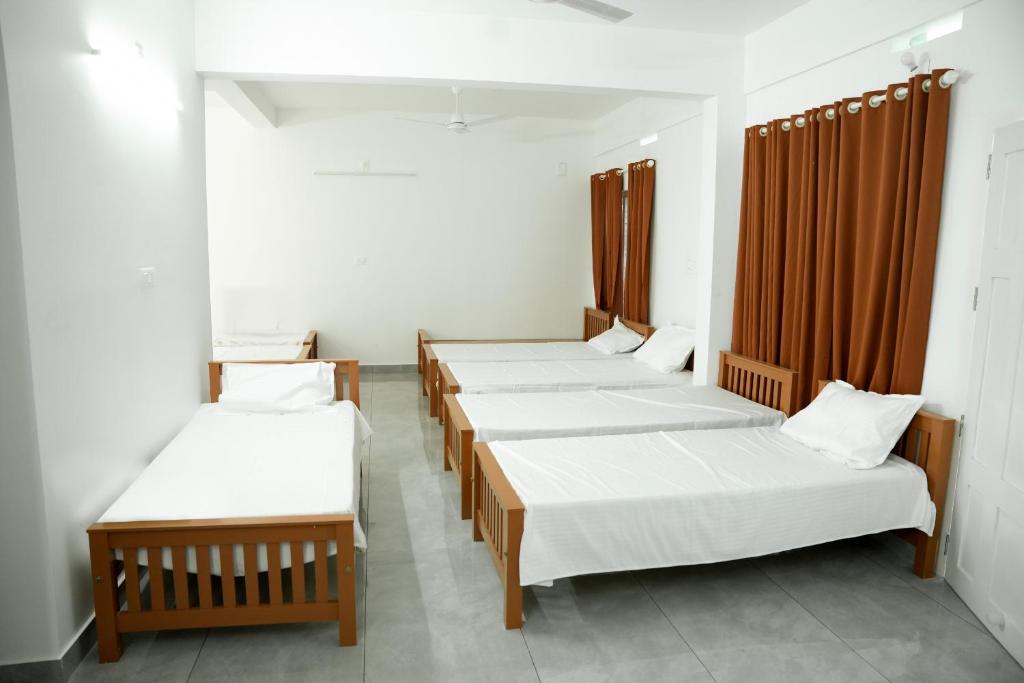 Voodi või voodid majutusasutuse Jayalakshmi Residency toas