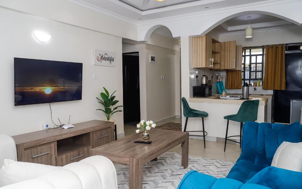 Kuchyň nebo kuchyňský kout v ubytování Cosy Flamingo furnished apartments