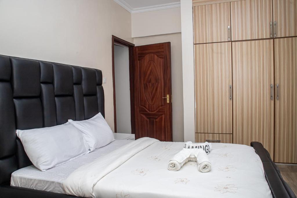 Postel nebo postele na pokoji v ubytování Cosy Flamingo furnished apartments