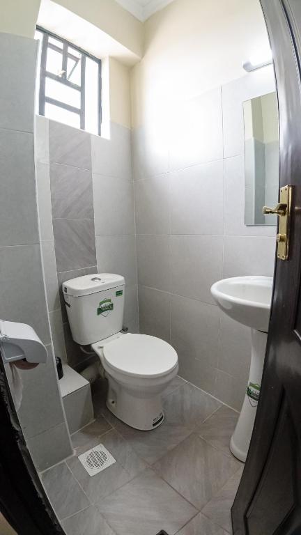 Koupelna v ubytování Cosy Flamingo furnished apartments