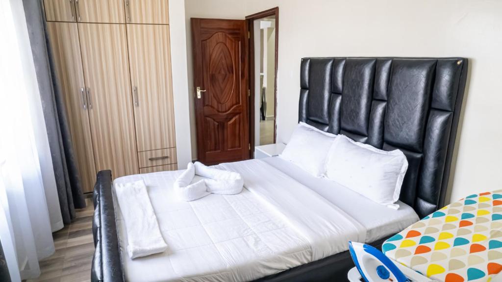 Postel nebo postele na pokoji v ubytování Cosy Flamingo furnished apartments