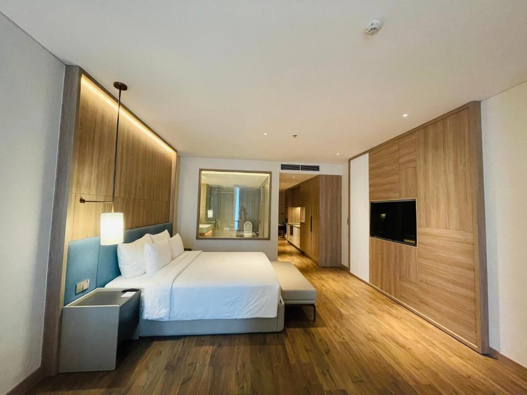 Voodi või voodid majutusasutuse Alacarte Ha Long toas