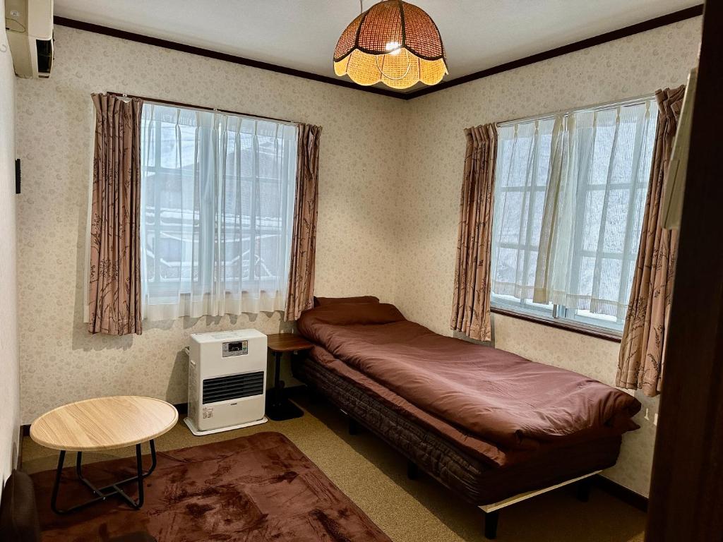 En eller flere senge i et værelse på 白馬の森 チロルハット