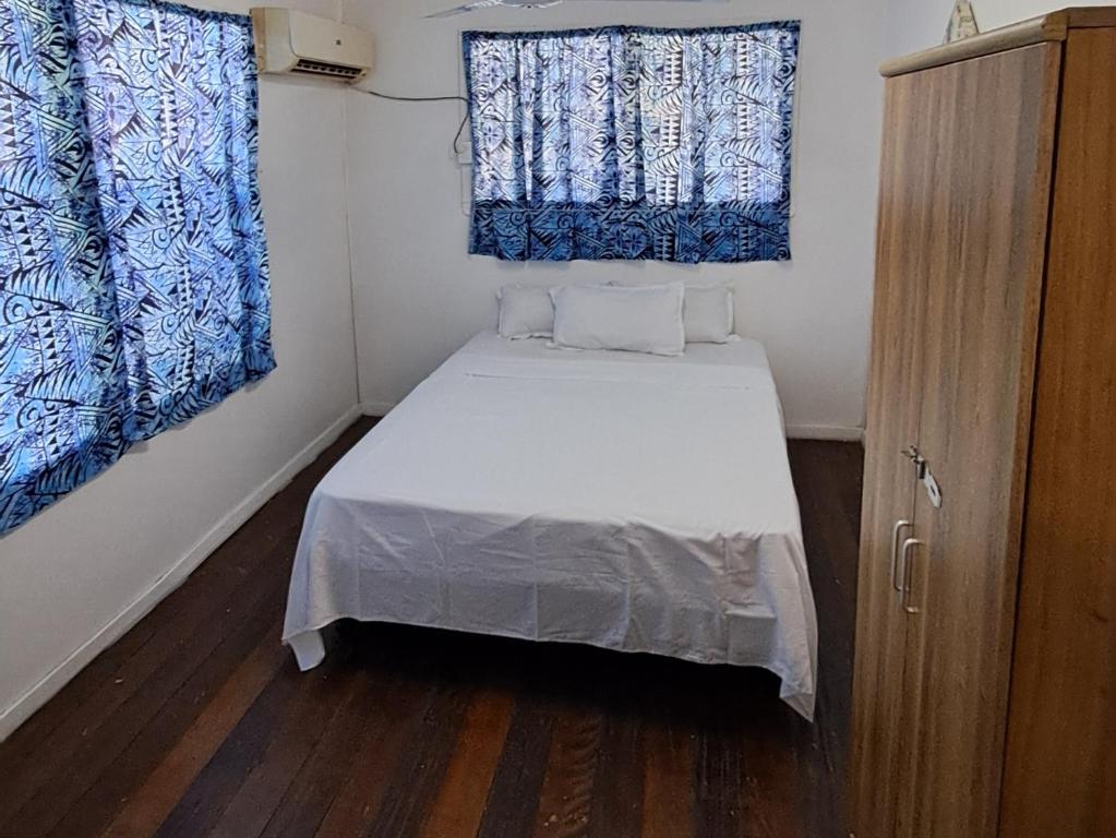 Postel nebo postele na pokoji v ubytování Samoa Home
