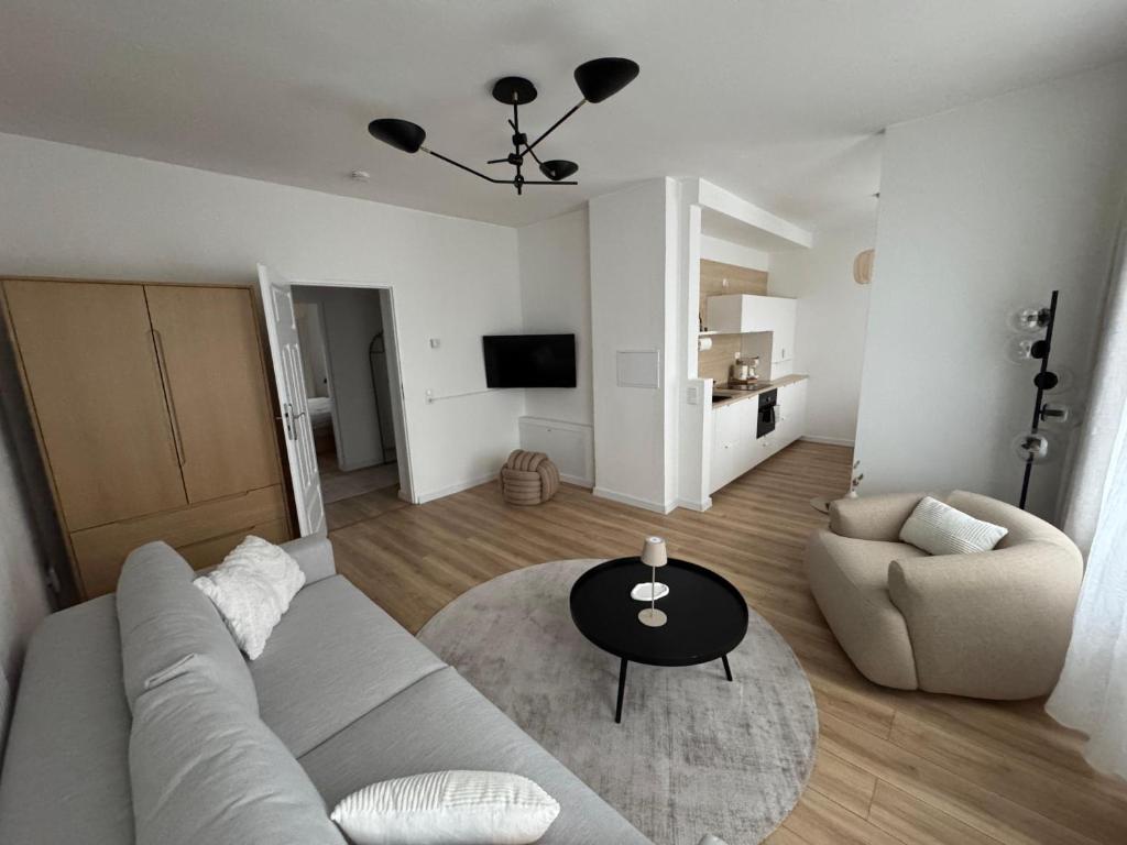 TV a/nebo společenská místnost v ubytování ApartNaest - vollausgestattete Apartments I kostenlos parken I flexibler Check-in I 1 bis 4 Zimmer I 1 bis 10 Personen
