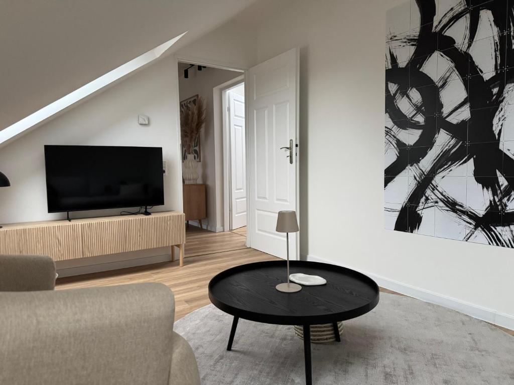 TV a/nebo společenská místnost v ubytování ApartNaest - vollausgestattete Apartments I kostenlos parken I flexibler Check-in I 1 bis 4 Zimmer I 1 bis 10 Personen