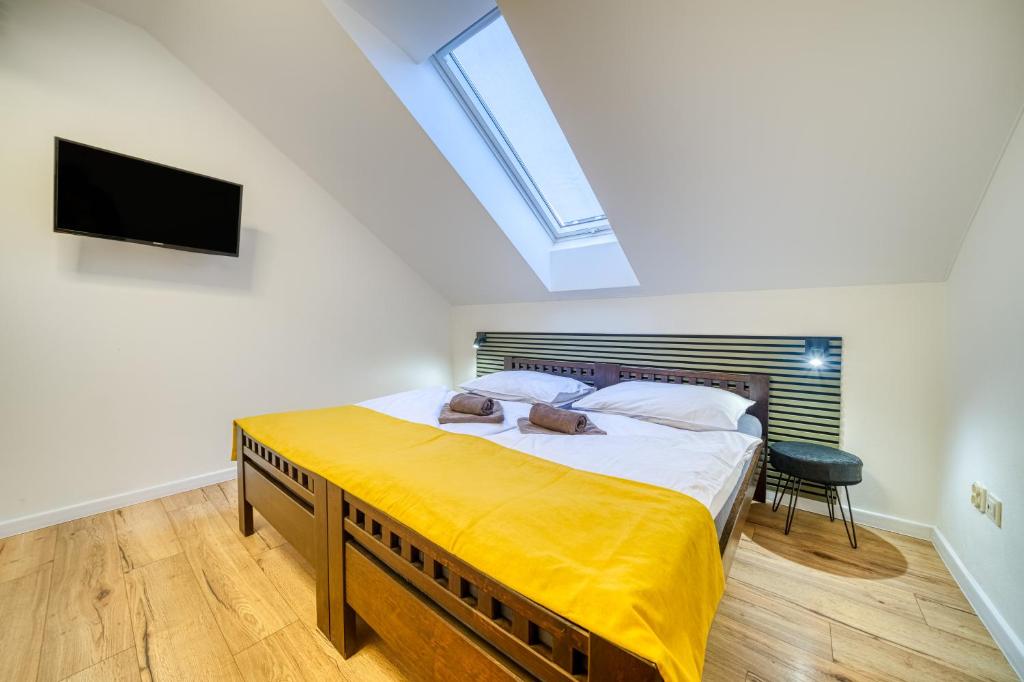 Postel nebo postele na pokoji v ubytování HM Apartments