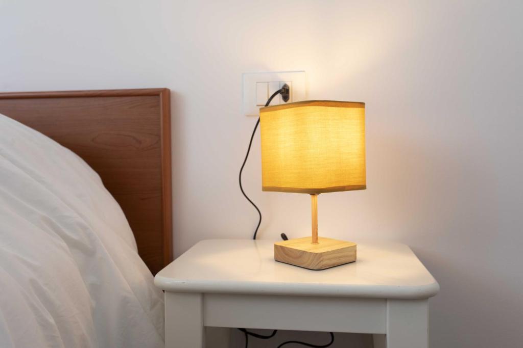 Postel nebo postele na pokoji v ubytování Max Rooms Bergamo