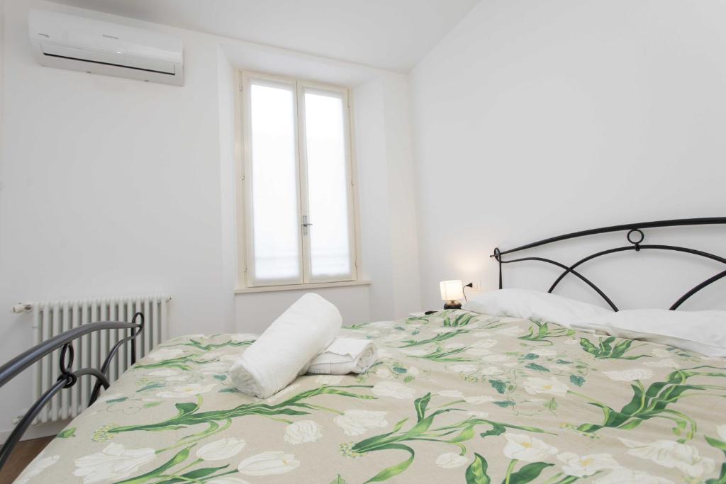 Postel nebo postele na pokoji v ubytování Max Rooms Bergamo