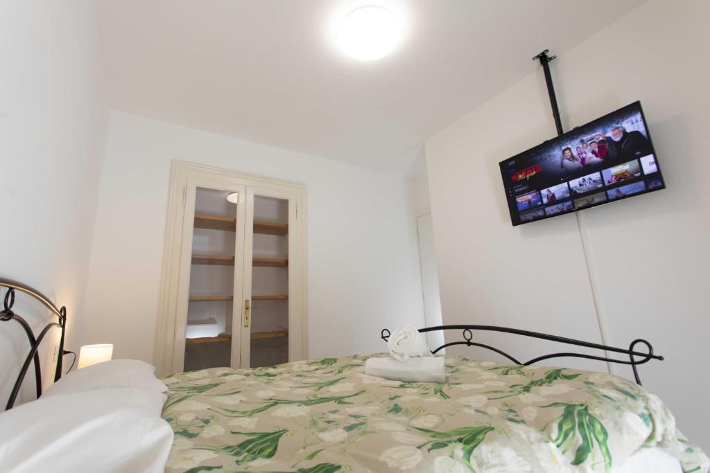 Postel nebo postele na pokoji v ubytování Max Rooms Bergamo