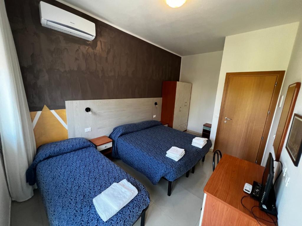 Postel nebo postele na pokoji v ubytování Club Vacanze In