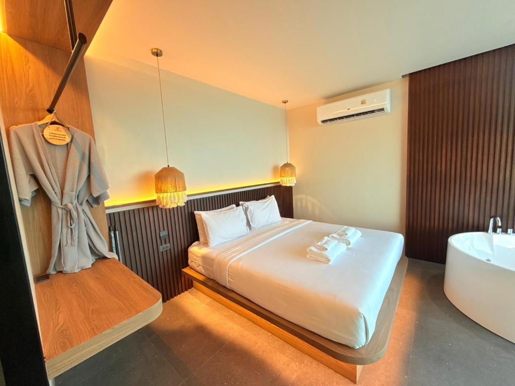 Postel nebo postele na pokoji v ubytování Sangthian Beach Resort