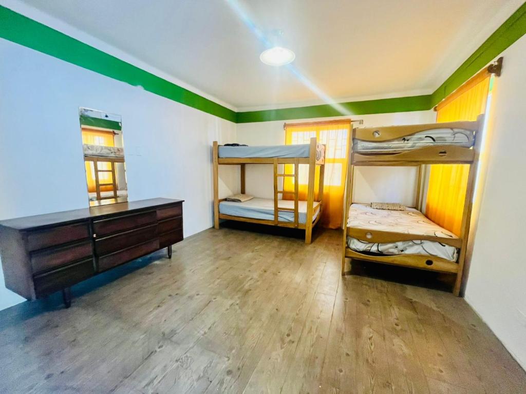Postel nebo postele na pokoji v ubytování Hostel rivendell lima